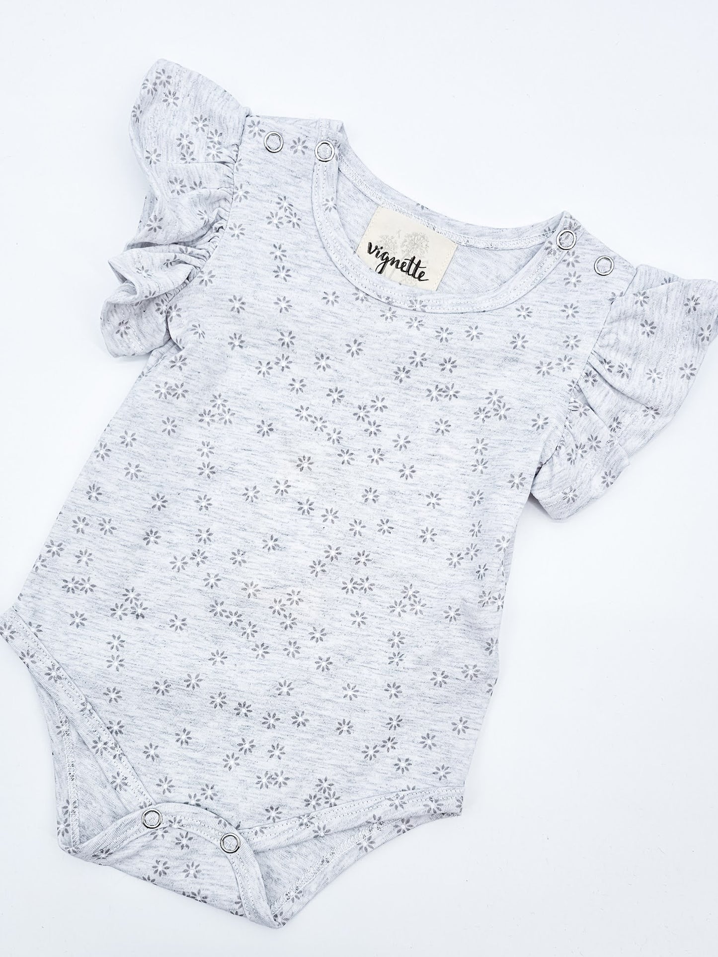 Soft Gray Baby Onesie with white  and gray daisies and short flutter sleeves